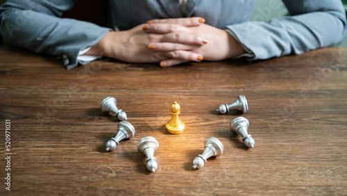 Human resources concept career management with clasped hands planning strategy with chess figures. HR department Search for employees by  inequality in the work collective