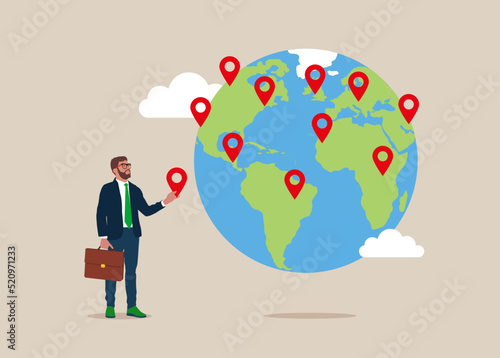 Businessman put new branch pin on world map across globe.Global business expansion, open company branches, franchise in new location to cover all continent, growing business worldwide.