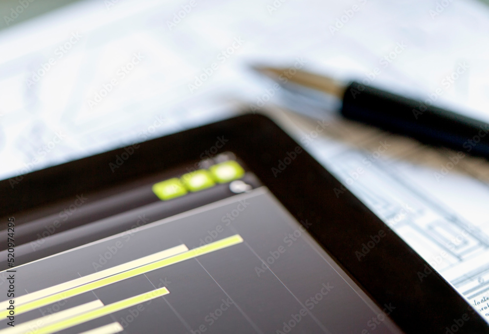 Examining Business Market on a Digital Tablet Examining Business Market on a Digital Tablet