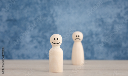 emotion faces on wooden doll for satisfaction survey