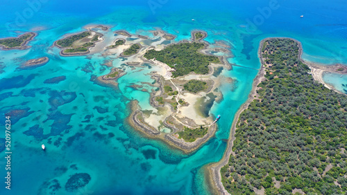 Fototapeta Naklejka Na Ścianę i Meble -  Aerial drone photo of tropical exotic island complex forming a blue lagoon with crystal clear turquoise sandy beaches