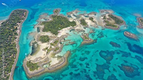 Aerial drone photo of tropical exotic paradise island complex in Mediterranean sea forming a blue lagoon archipelago with crystal clear turquoise sea sandy beaches © aerial-drone