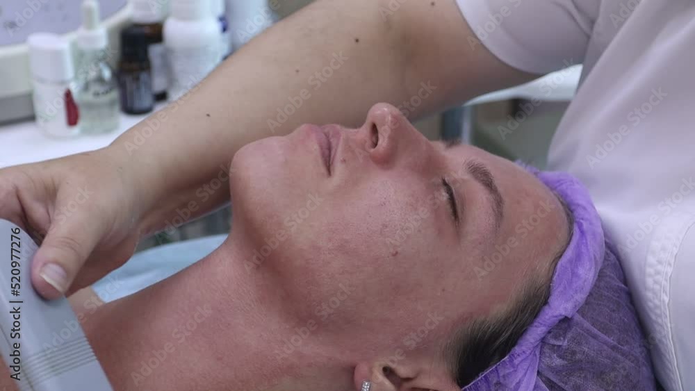 Ultrasonic facial cleaning and rejuvenation procedure in a beauty salon Ultrasonic facial cleaning and rejuvenation procedure in a beauty salon