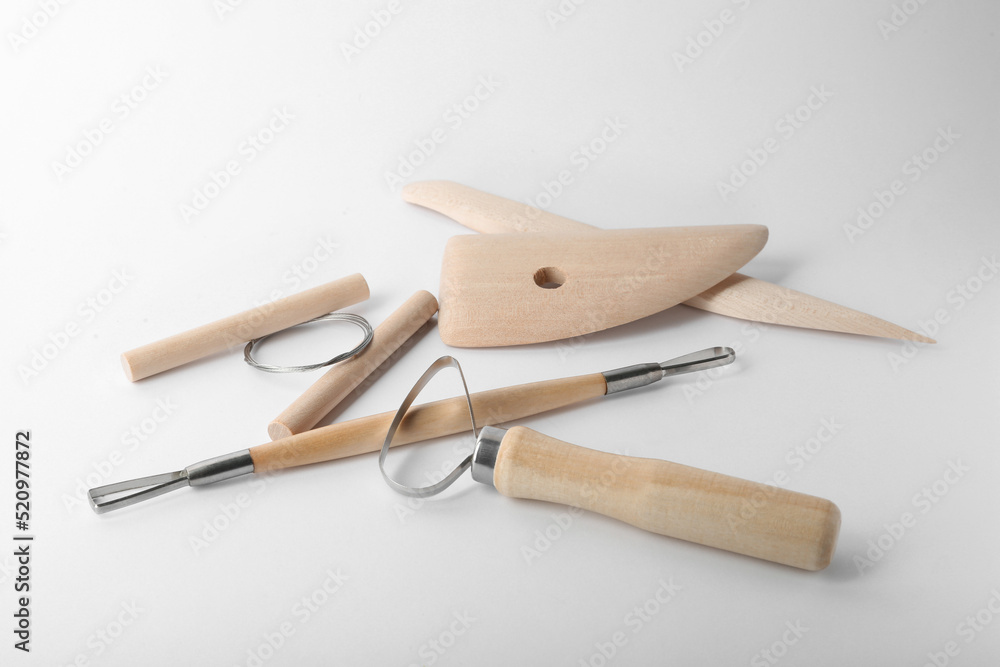 Set of clay modeling tools on white background Set of clay modeling tools on white background