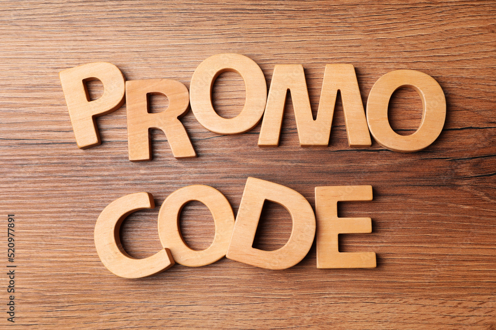 Words Promo Code made of wooden letters on table, flat lay Words Promo Code made of wooden letters on table, flat lay