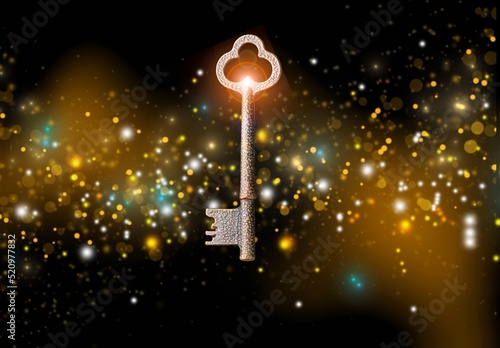 фотографія Golden key with glowing lights and dark background, wisdom, wealth concept