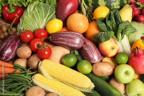 Assortment of fresh organic fruits and vegetables as background  top view