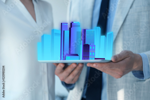 People holding tablet with virtual image of city, closeup