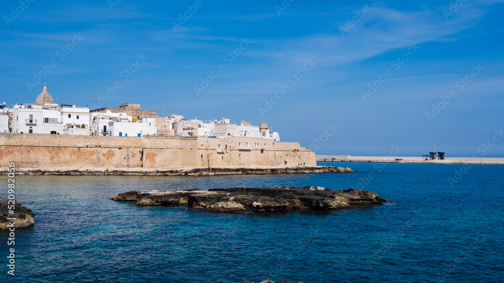 view of the old town and blue sea of Monopoli, Puglia. Italy