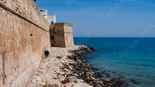 cliff and tower of the old town. Monopoli, Puglia. Italy