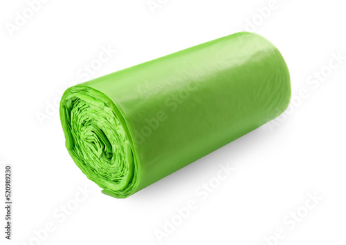 Roll of green garbage bags isolated on white