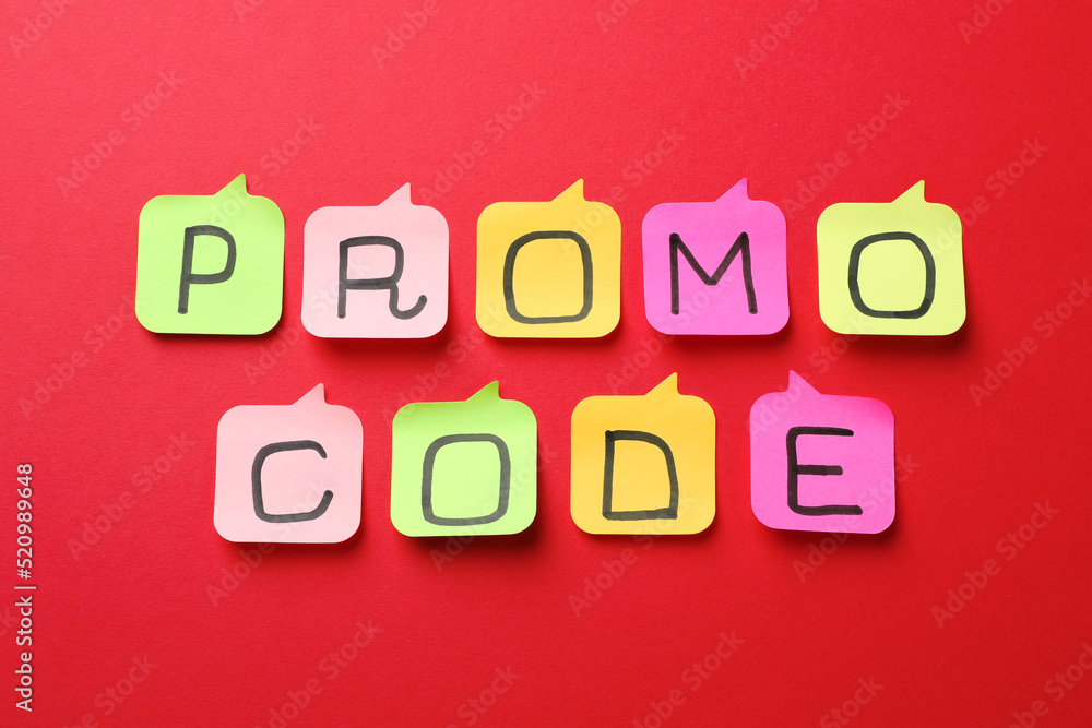 Sticky notes with words Promo Code on red background, flat lay Sticky notes with words Promo Code on red background, flat lay