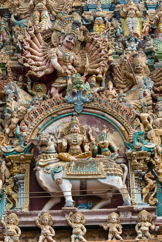 Sculpture of Demo, Lord Shiva and Parvati on. Meenakshi Amman Temple Gopuram, Madurai, Tamilnadu, India.