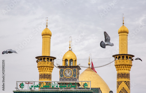 The shrine of Abbas, son of Imam Ali, peace be upon him, in Karbala, Iraq, with Imam Hussein, peace be upon him photo