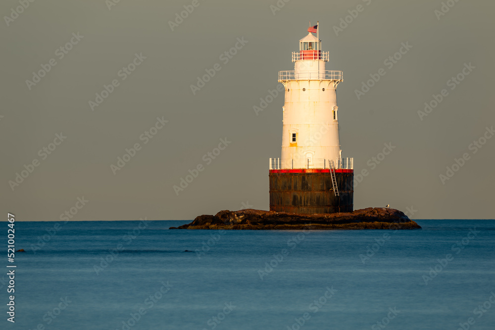 07/10/2022 - Little Compton, RI USA - Early morning image of the Sakonnet Point Light (West Island Light) between Little Compton and Tiverton Rhode Island, at Sakonnet River and Atlantic Ocean. 07/10/2022 - Little Compton, RI USA - Early morning image of the Sakonnet Point Light (West Island Light) between Little Compton and Tiverton Rhode Island, at Sakonnet River and Atlantic Ocean.