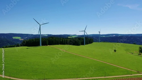 Aerial video of wind power plant on the hilltop between fir trees. St. Peter, Black forest, Germany.
Concept  for regenerative energy and energy crisis.