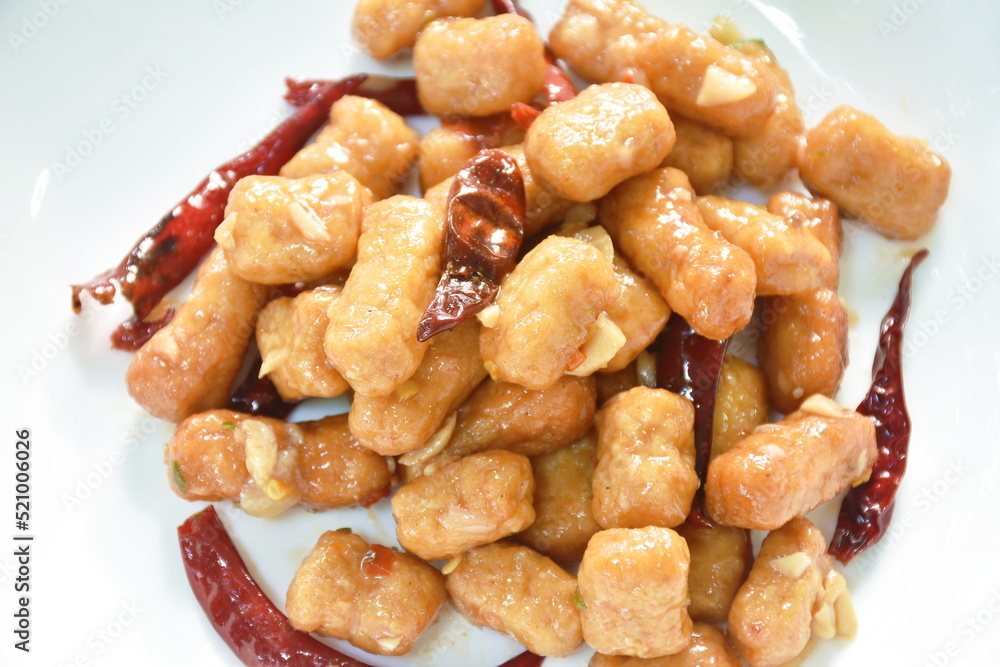 fried chicken meat with dry chili on plate fried chicken meat with dry chili on plate