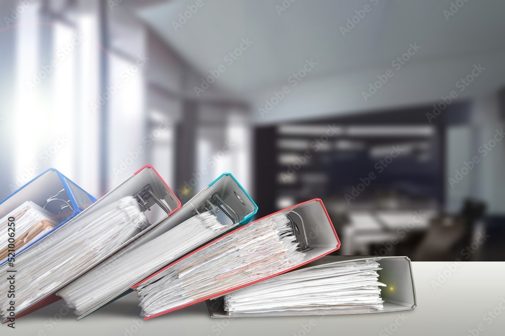 stack of reporting paper documents on a business table in the office