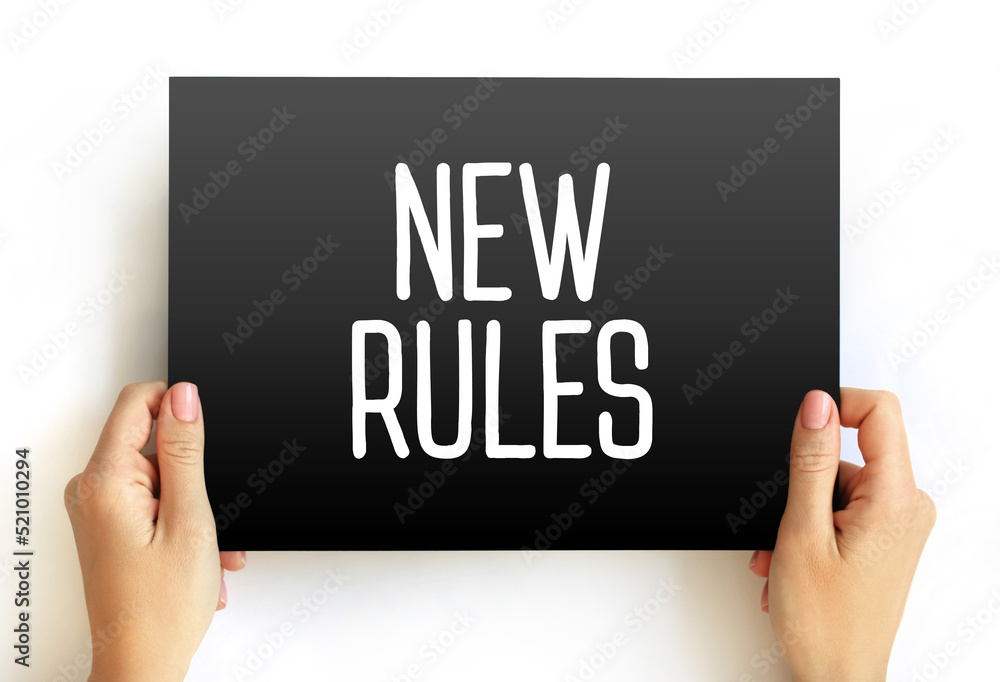 NEW RULES text concept on card for presentations and reports NEW RULES text concept on card for presentations and reports