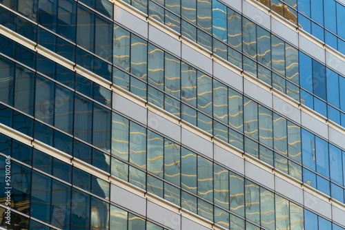 sky-high glass windows office building texture background