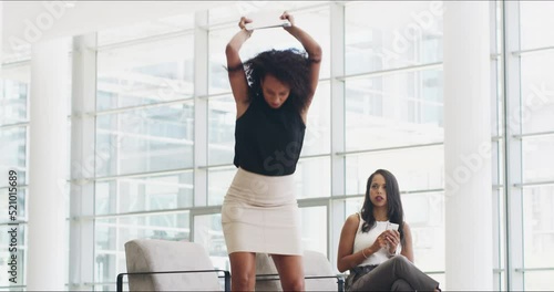 Angry, crazy and stressed woman breaking laptop, throwing paperwork and destroying technology in front of shocked female colleague. Frustrated and aggressive business woman failing online deadline