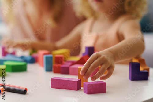 Obraz na plátně Child playing with wooden blocks