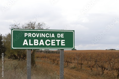 Green road sign with white letters indicating the provincial limit with the Spanish province of Albacete