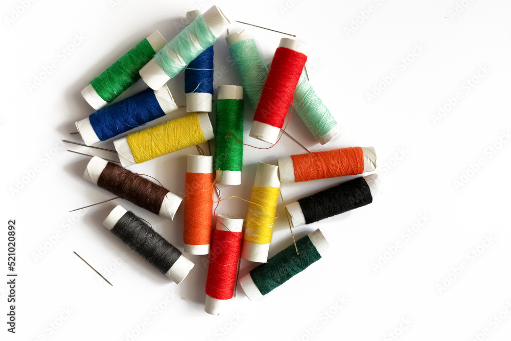 spools of threads on a white background spools of threads on a white background