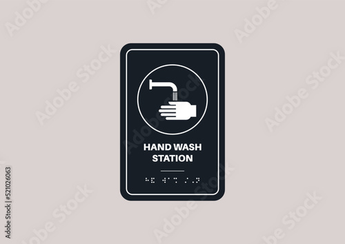 Hand wash station sign written with braille text
