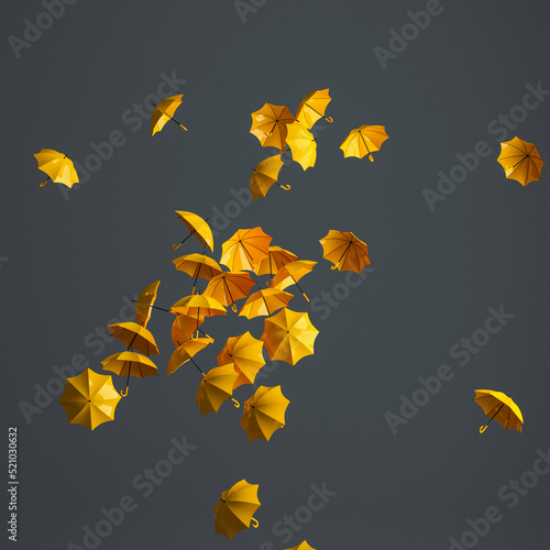 Flying yellow umbrellas on gray background with copy space. Autumn symbol. Fall colors. 3D rendering.