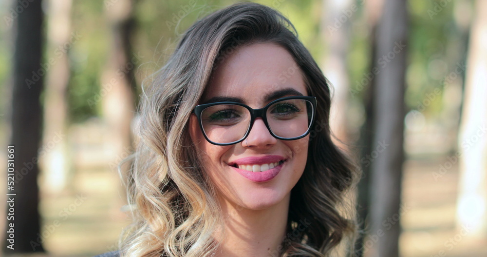 Pretty woman wearing glasses opening eyes and looking to camera smiling. Smart woman Pretty woman wearing glasses opening eyes and looking to camera smiling. Smart woman