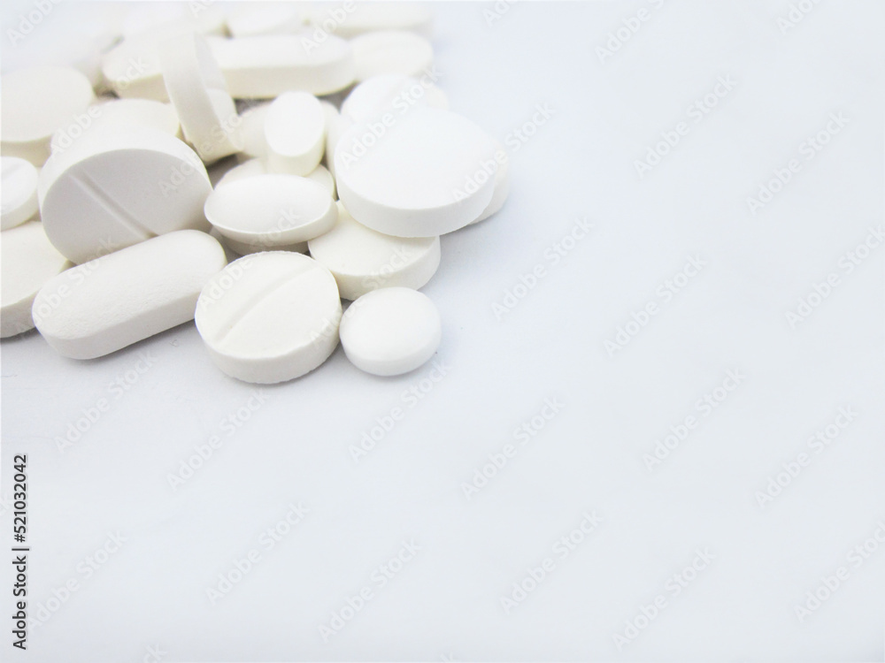 Pharmacy, stack of white flat medicine tablet pills. shallow DOF Pharmacy, stack of white flat medicine tablet pills. shallow DOF