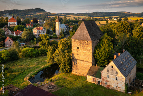 The gothic Siedlecin Ducal Tower illuminated by the setting sun in the Bobr Valley Landscape Park, Lower Silesia. Poland
