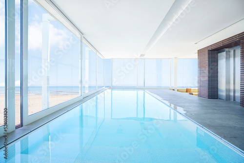 Luxury indoor pool by the beach © Polarpx