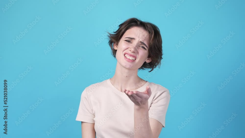Lady feel frustration forget friend birthday isolated on blue color background Lady feel frustration forget friend birthday isolated on blue color background