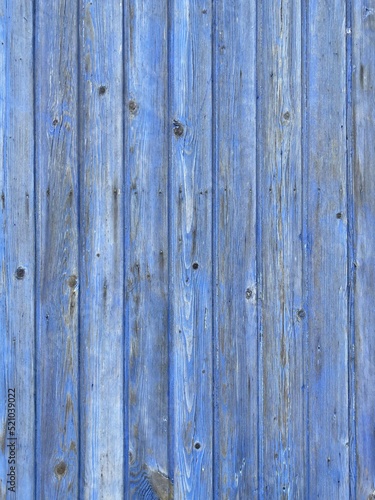 a light blue painted washed out plank wall