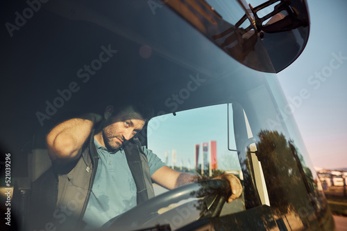 Принти на полотні Truck driver having neck pain during long ride on the road.
