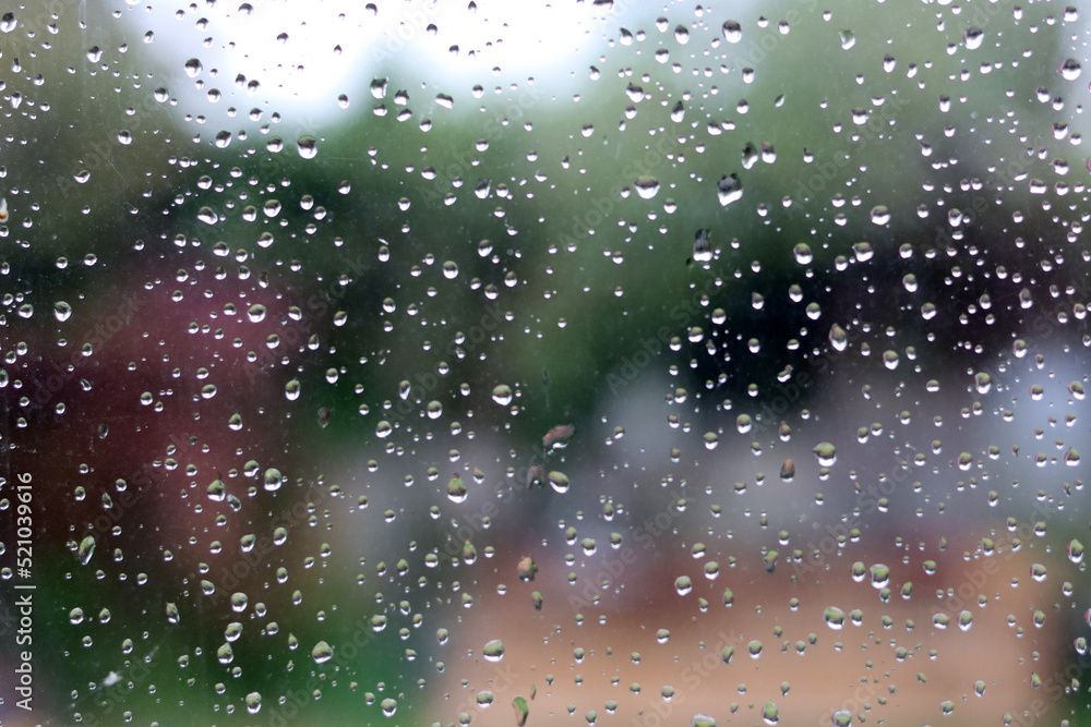 Rain drops on a window. Abstract background. Drops on a glass surface. 