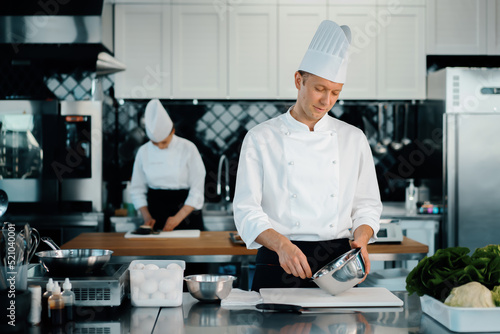 Professional restaurant kitchen: chefs prepare a delicious dish