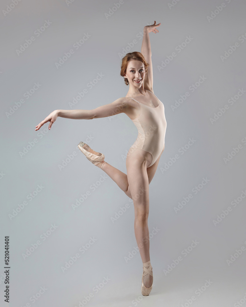 Fototapeta premium charming ballerina posing in the studio on a white background