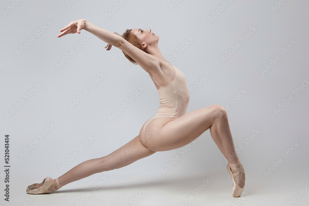 charming ballerina posing in the studio on a white background charming ballerina posing in the studio on a white background