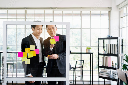 Wallpaper Mural Group of successful Asian businessmen teamwork. Brainstorm meeting with sticky paper notes on the glass wall for new ideas. Using agile methodology for business in a tech start-up office. Torontodigital.ca