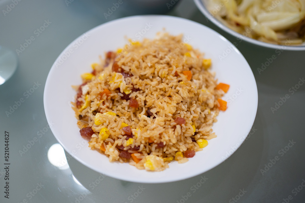 Home cook pork sausage fried rice in white plates Home cook pork sausage fried rice in white plates