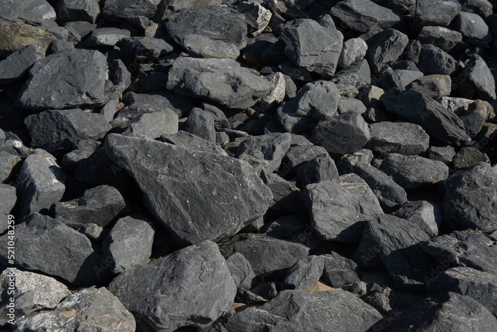 black rough stone background and texture.Selective focuc. black rough stone background and texture.Selective focuc.