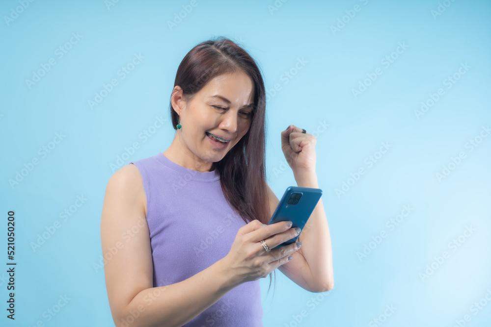 Asian woman was surprised and excited about the smartphone. Asian woman was surprised and excited about the smartphone.