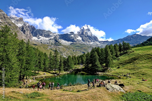 Summer alpine landscape with the Matterhorn (Cervino) reflected on the Blue Lake (Lago Blu) near Breuil-Cervinia. Aosta Valley, Italy - August 2022