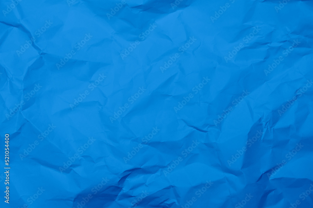 Blue crumpled paper texture background. Blue wrinkled paper texture background. Blue crease fabric texture background. Blue wrinkled fabric texture background.