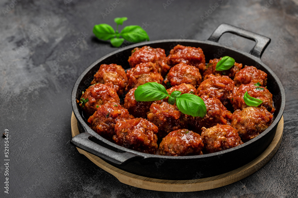 Traditional spicy meatballs in sweet and sour tomato sauce. Restaurant menu, dieting, cookbook recipe top view Traditional spicy meatballs in sweet and sour tomato sauce. Restaurant menu, dieting, cookbook recipe top view