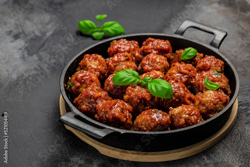 Traditional spicy meatballs in sweet and sour tomato sauce. Restaurant menu, dieting, cookbook recipe top view