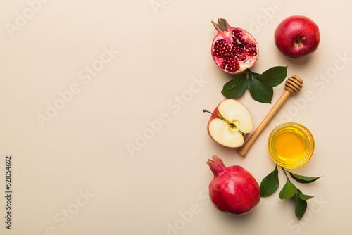 Flat lay composition with symbols jewish Rosh Hashanah holiday attributes on colored background, Rosh hashanah concept. New Year holiday Traditional. Top view with copy space photo